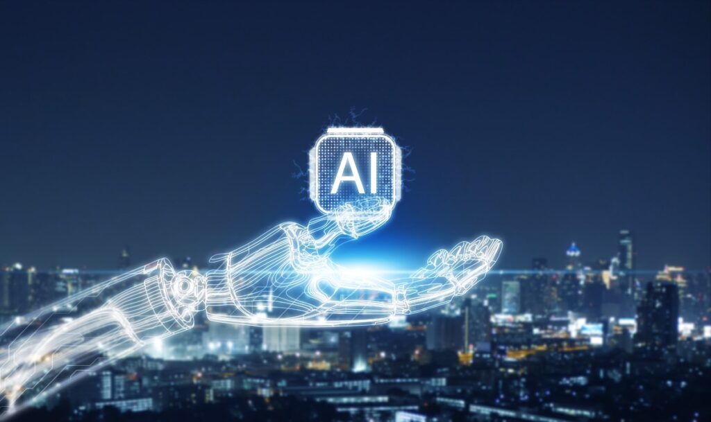 Concept of artificial intelligence. Glowing robotic hand and AI symbol over cityscape at night, representing innovation, digital transformation, and smart technology evolution.