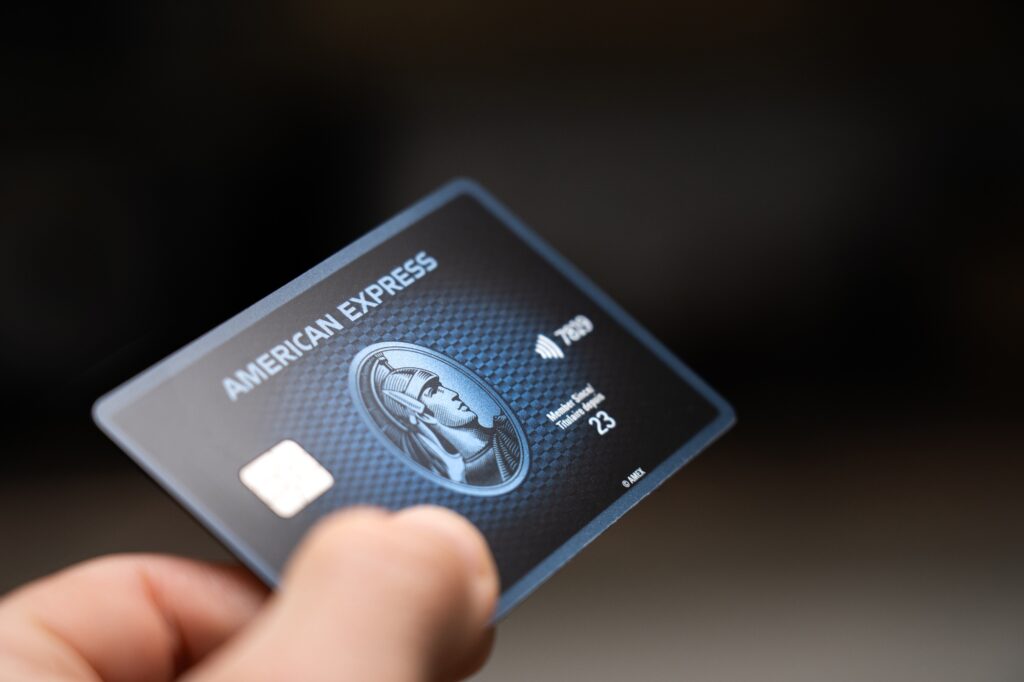 Hand holding an Amex card