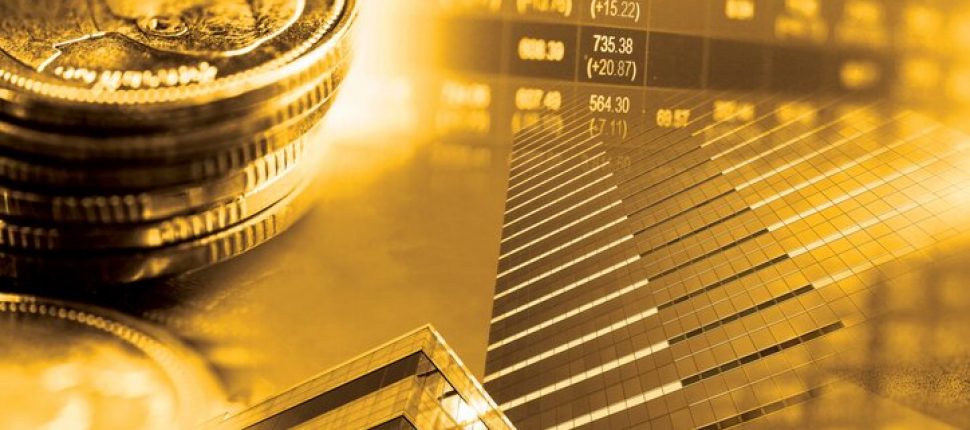 Gold stack of coins, gold building, and golden stock charts
